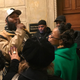 Umar Johnson, surrounded by his supporters after his hearing before the Pennsylvania State Board of Psychology (Michael Harriot/The Root)